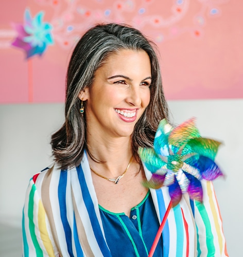 a woman wearing a colorful dress