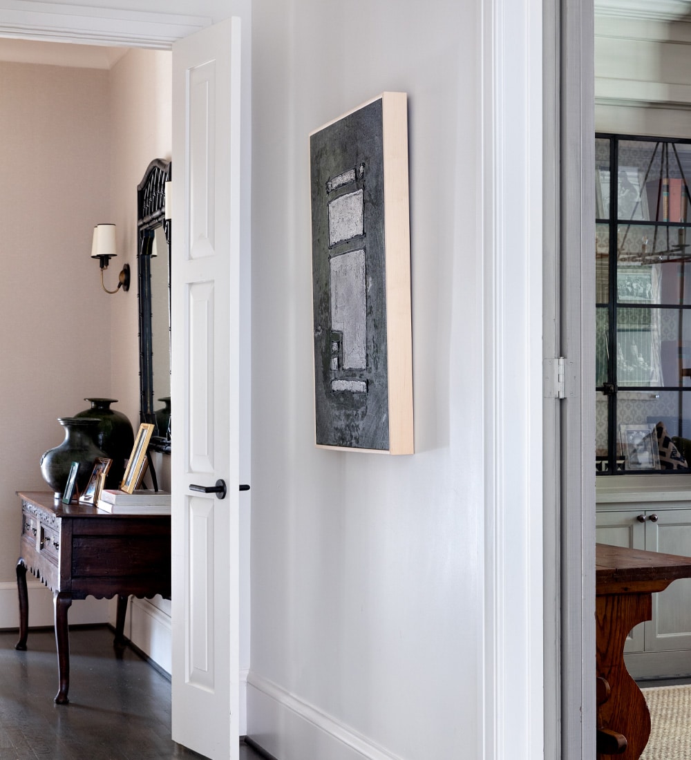 a living room with a large mirror