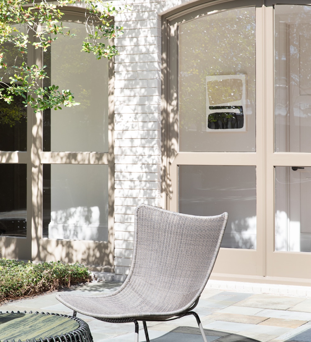 a chair sitting in front of a window