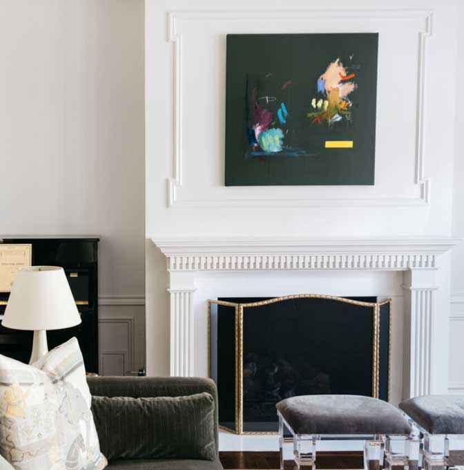 a living room filled with furniture and a fireplace