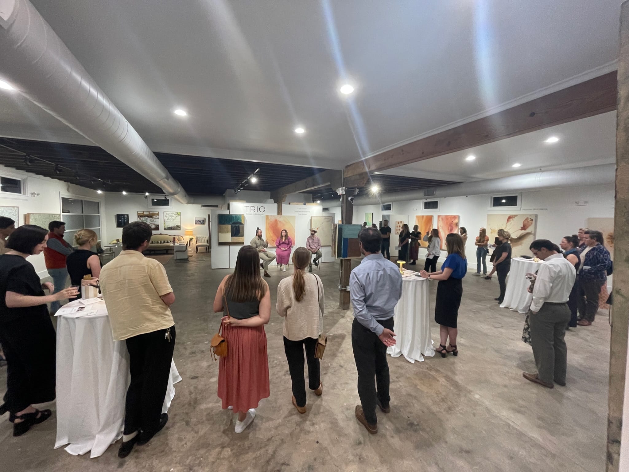 a group of people standing in a room