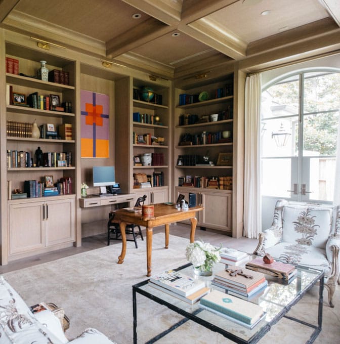 a living room filled with furniture and a large window