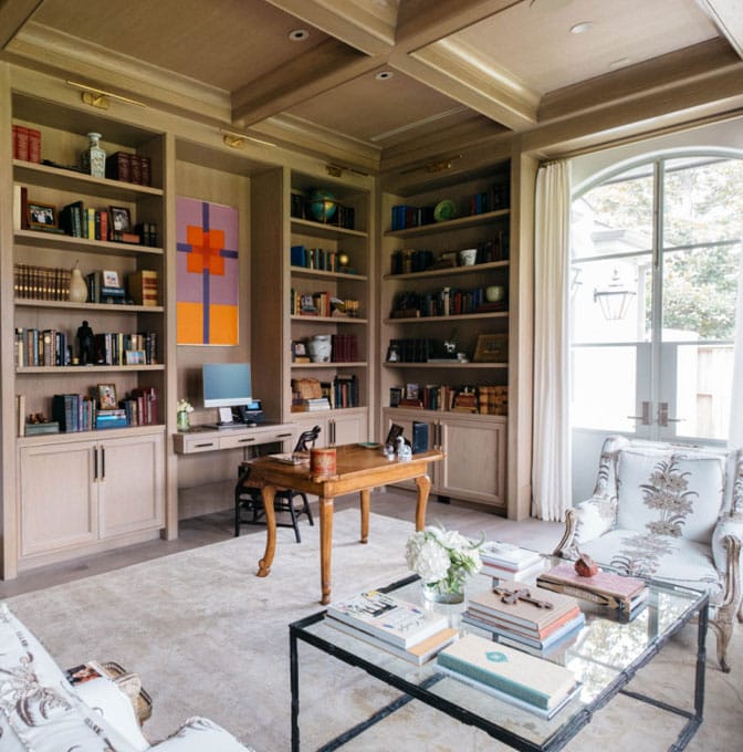 a living room filled with furniture and a large window