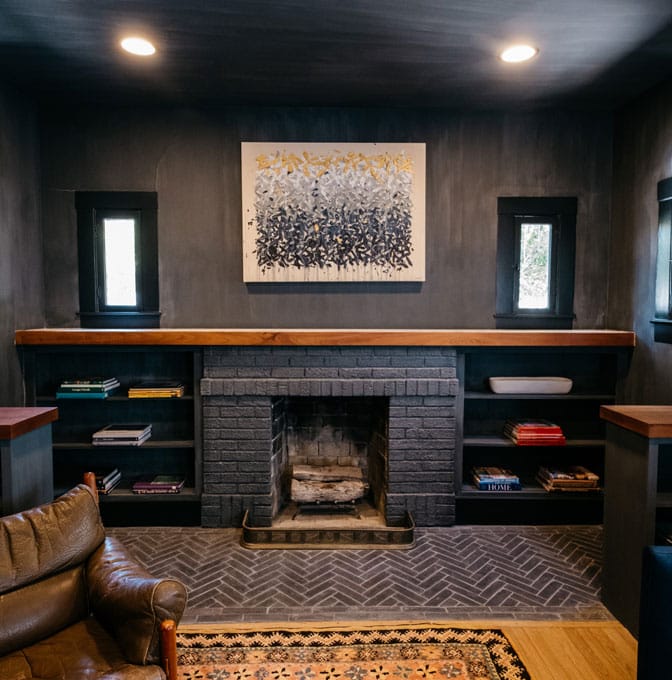 a living room filled with furniture and a fire place