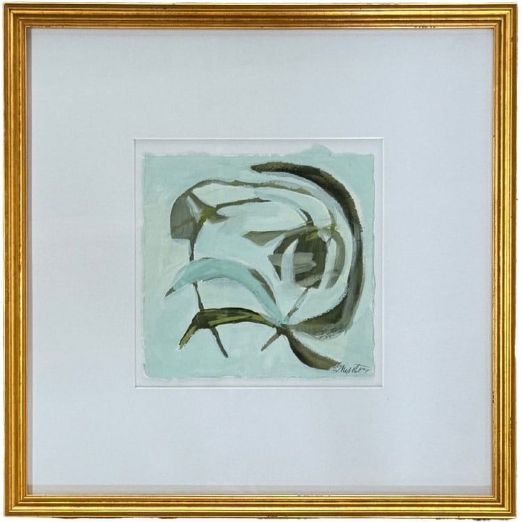a painting in a frame hanging on a wall